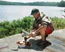 Fileting the trout with a birch log and axe on McIntyre 2008