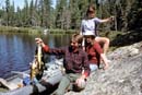 Man holding fish.<BR>Walleye Lake, August 86