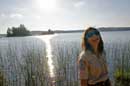 Assistant Quetico Park Naturalist, Cristina Apavaloae on the shore of French Lake.