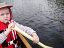 Granddaughter Anna, age 4, paddling on Poplar Lake in 2007..