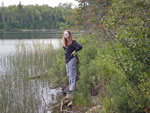 Our granddaughter surveying the possibilities of a paddle on Aspen Lake.