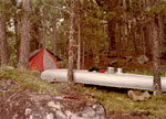 Camp on narrow point opposite East Bend Island, LLC.  We watched firefighting planes at work over a small island.  1980